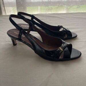 Cole Haan black strapped heels. Size 9B heel measurement are 2.9 inches